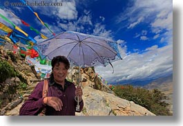 asia, emotions, flags, horizontal, lhasa, monastery hike, old, prayers, smiles, tibet, tibetan, umbrellas, womens, photograph