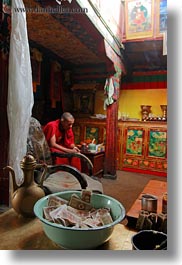 alone, asia, buddhist, cash, lhasa, men, money, monks, people, religious, rooms, sitting, tibet, vertical, photograph