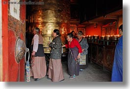 asia, buddhist, glow, horizontal, lhasa, old, people, prayers, religious, temples, tibet, turbine, turning, womens, photograph
