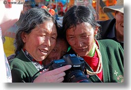 asia, cameras, emotions, horizontal, lhasa, looking, people, smiles, tibet, tibetan, womens, photograph