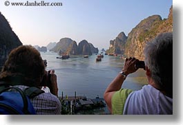asia, boats, cameras, ha long bay, harbor, horizontal, mountains, nature, people, photographing, tourists, vietnam, womens, photograph
