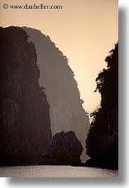 asia, ha long bay, hazy, mountains, ocean, sunsets, vertical, vietnam, photograph