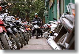 asia, bikes, driving, hanoi, horizontal, motorcycles, people, vietnam, photograph