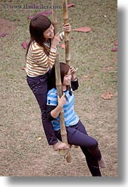 asia, couples, hanoi, people, swings, two, vertical, vietnam, womens, photograph