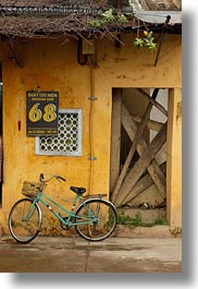 asia, bicycles, bikes, hoi an, vertical, vietnam, walls, yellow, photograph