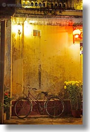 asia, bicycles, bikes, hoi an, nite, red, vertical, vietnam, walls, yellow, photograph
