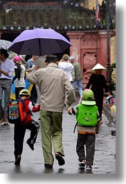 asia, boys, childrens, hoi an, men, old, people, umbrellas, vertical, vietnam, walking, photograph