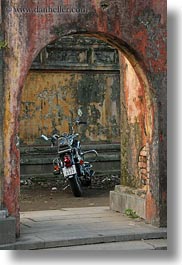 archways, asia, citadel, doorways, hue, motorcycles, old, vertical, vietnam, photograph