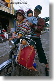 asia, asian, childrens, fathers, hue, motorcycles, people, vertical, vietnam, photograph