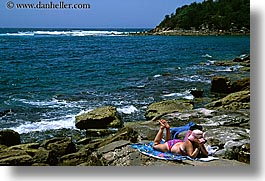 australia, horizontal, manly beach, reading, rocks, sydney, womens, photograph