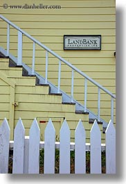 bank, buildings, california, colors, fences, land, mendocino, signs, structures, vertical, west coast, western usa, yellow, photograph