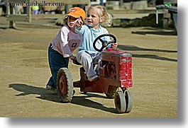 california, childrens zoo, girls, horizontal, san francisco, toddlers, tractor, west coast, western usa, zoo, photograph