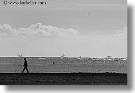 beaches, black and white, california, clouds, horizontal, men, nature, oil rig, oils, rigs, santa barbara, sky, structures, walking, west coast, western usa, photograph
