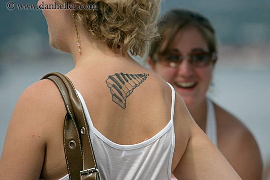 Women's tattoo designs are also less heavy, less aggressive-looking.