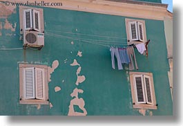 blues, buildings, colors, cres, croatia, europe, green, horizontal, jeans, laundry, photograph