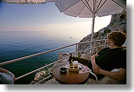 cafes, cliff cafe, croatia, dubrovnik, europe, horizontal, loungers, men, ocean, people, umbrellas, photograph