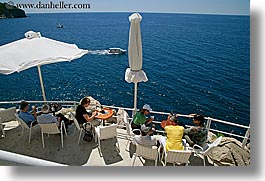 cafes, cliff cafe, cliffs, croatia, dubrovnik, europe, horizontal, ocean, people, umbrellas, photograph
