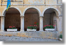 archways, cloisters, cobblestones, croatia, europe, flowers, groznjan, horizontal, materials, stones, structures, photograph