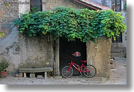 bicycles, croatia, europe, green, groznjan, horizontal, ivy, red, photograph