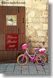 bicycles, croatia, doors, europe, girls, hvar, vertical, photograph