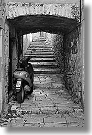 arches, archways, black and white, croatia, europe, korcula, motorcycles, stairs, under, vertical, photograph