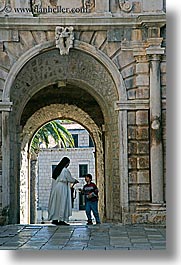 arches, archways, boys, childrens, croatia, europe, korcula, nuns, religious, sequence, vertical, womens, photograph