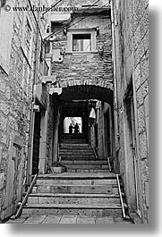 arches, archways, black and white, croatia, europe, korcula, people, silhouettes, stairs, under, vertical, photograph