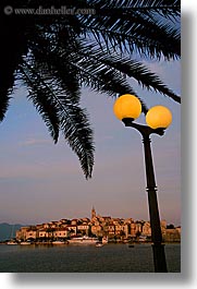 cityscapes, croatia, europe, korcula, lamp posts, palmtree, sunsets, vertical, water, photograph