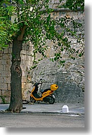 croatia, europe, korcula, motorcycles, trees, vertical, yellow, photograph