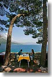 cafes, couples, croatia, europe, korcula, ocean, scenics, shade tree, vertical, viewing, photograph