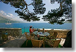 cafes, croatia, europe, horizontal, korcula, ocean, scenics, shade tree, viewing, womens, photograph