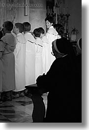 black and white, boys, croatia, europe, milna, nuns, people, praying, religious, smiling, vertical, womens, photograph