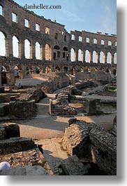 amphitheater, architectural ruins, archways, buildings, cloisters, croatia, europe, pula, roman, structures, vertical, photograph