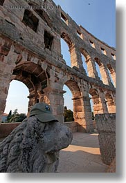 amphitheater, architectural ruins, archways, buildings, croatia, europe, lions, pula, roman, structures, vertical, photograph