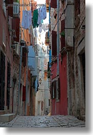 clothes, cobblestones, croatia, europe, hangings, laundry, materials, narrow, narrow streets, rovinj, stones, streets, vertical, photograph