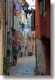 cobblestones, croatia, europe, hangings, laundry, materials, narrow, narrow streets, rovinj, stones, streets, vertical, photograph
