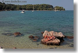 croatia, europe, horizontal, people, rocks, rovinj, sexy, sunbathing, water, womens, photograph