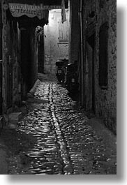 black and white, cobblestones, croatia, europe, materials, motorcycles, narrow streets, roads, rovinj, stones, streets, vertical, photograph