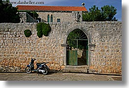 arches, croatia, doors, europe, horizontal, motorcycles, sipan, photograph