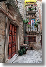 balconies, buildings, croatia, doors, europe, ornate, stones, trogir, vertical, photograph