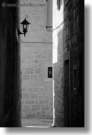 black and white, croatia, europe, lamp posts, lamps, narrow streets, streets, trogir, vertical, photograph