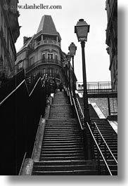 black and white, buildings, europe, france, going, lamp posts, lights, paris, perspective, stairs, upview, vertical, photograph