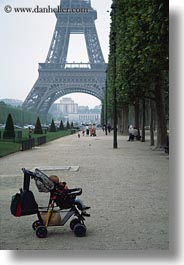 babies, buildings, eiffel tower, europe, france, haze, paris, stroller, structures, towers, vertical, photograph