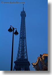 buildings, dusk, eiffel tower, europe, france, glow, lamp posts, lights, paris, structures, towers, vertical, photograph