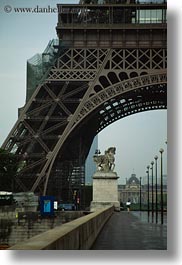buildings, eiffel tower, europe, france, haze, paris, pedestrians, sidewalks, structures, towers, vertical, photograph
