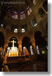crosses, domes, europe, france, glow, lights, materials, notre dame, paris, stained glass, statues, under, vertical, photograph
