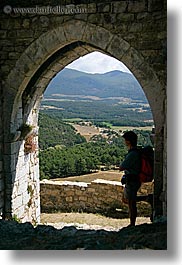 arches, archways, bargeme, doors, europe, france, gothic, hikers, materials, men, people, provence, scenics, silhouettes, stones, structures, vertical, photograph