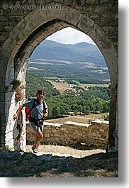 arches, archways, bargeme, doors, europe, france, gothic, hikers, men, people, provence, scenics, structures, vertical, photograph