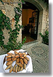 bread, doors, europe, foods, france, materials, provence, stones, vertical, photograph