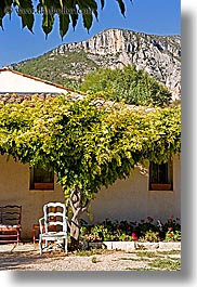 chairs, colors, europe, france, green, houses, mountains, moustiers, provence, st marie, vertical, photograph